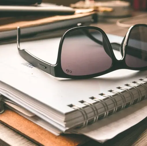Export paperwork and binders on a desk