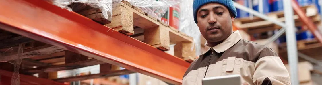 Warehouse team tracking a shipment on a tablet